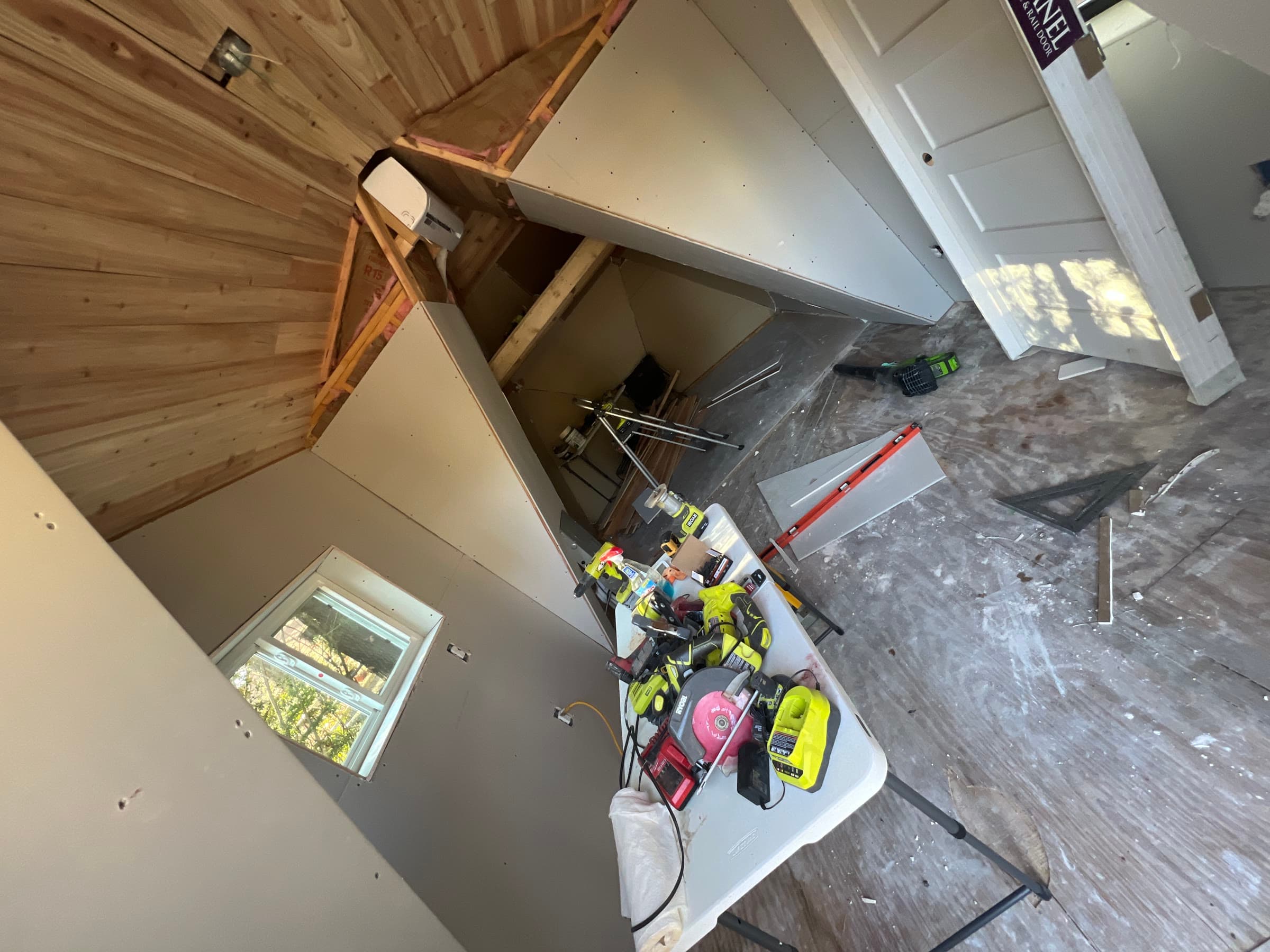 Interior with finished cedar ceiling and built-in cabinetry mid-build